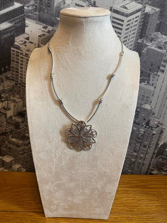 Quirky Floral Design Pendant In A Silver Colour With Solid Linear Link Chain